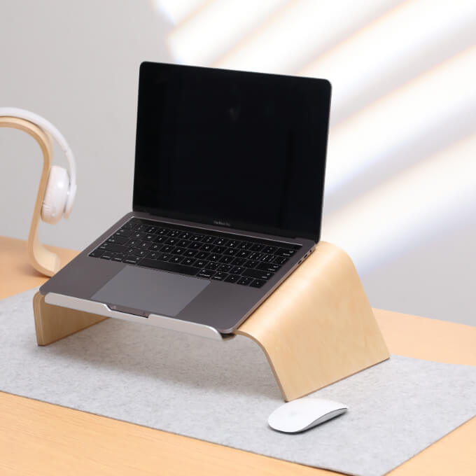 laptop stand with mouse on fixed desk