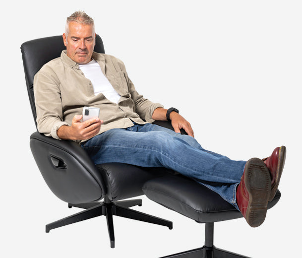 person sitting on buro maya chair with his phone