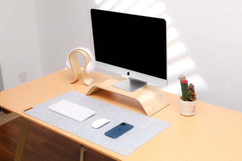 grey deskpad on fixed desk