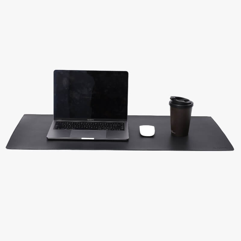 deskpad with apple macbook pro on it