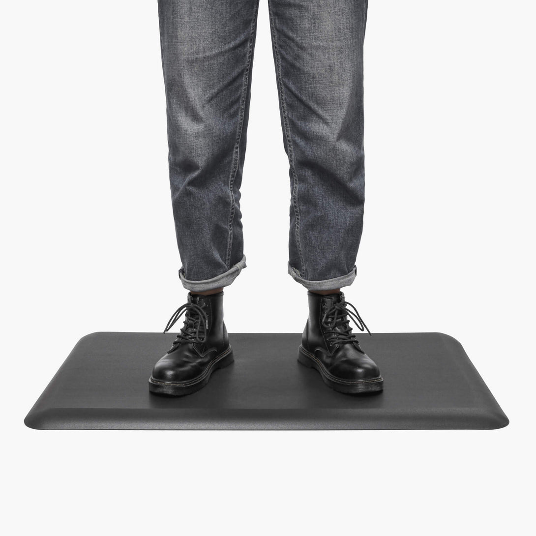 person standing in the office on the anti fatigue mat