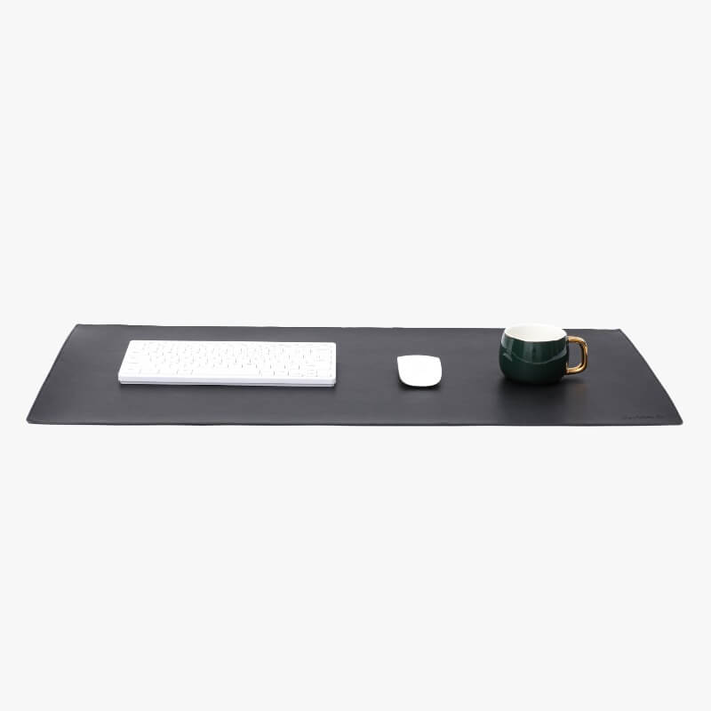 black deskpad with mouse and keyboard